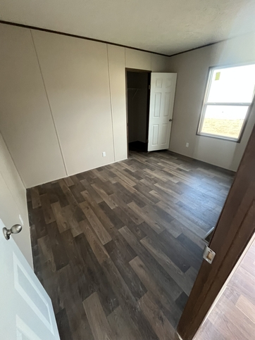 9'-5" x 12'x7" Guest bedroom with walk in closet