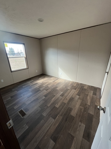 10'-0" x 12'x7" Guest bedroom with walk in closet