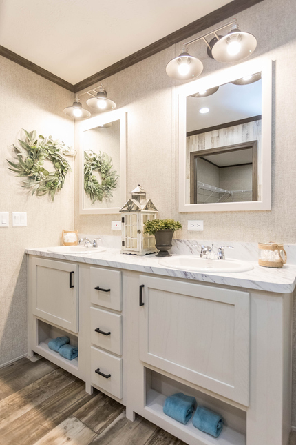  Light and bright with plenty of storage in this master bath of this Inspiration Hyatt Model 186046 manufactured home by Fairmont Homes.