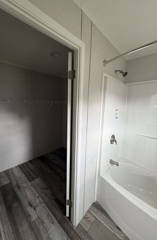 Master bedroom closet in master bath