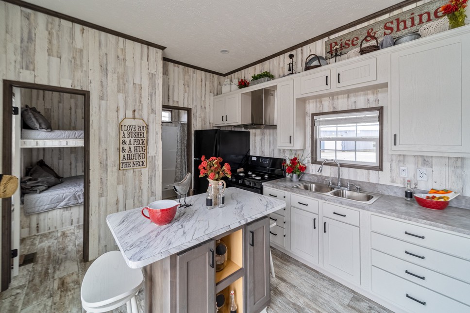 The kitchen is a model of modern efficiency and style in park model 190002 by Fairmont Homes.