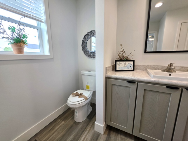 The primary bathroom is your retreat- 
Enjoy a beautiful walk-in shower with built-in bench, china sink & commode, natural light, & even more space to stay organized w/2 additional storage closets, beyond the large walk-in closet in the master.