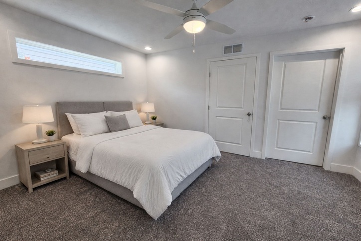 The spacious primary suite features upgraded plush carpet, a ceiling fan, a large walk-in closet with ClosetMaid® shelving, and plenty of room for your bedroom furniture and TV. It’s all complemented by a beautifully appointed master bathroom design.