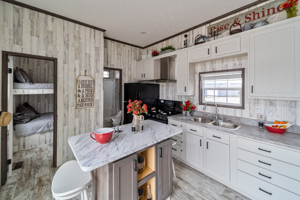 The kitchen is a model of modern efficiency and style in park model 190002 by Fairmont Homes.
