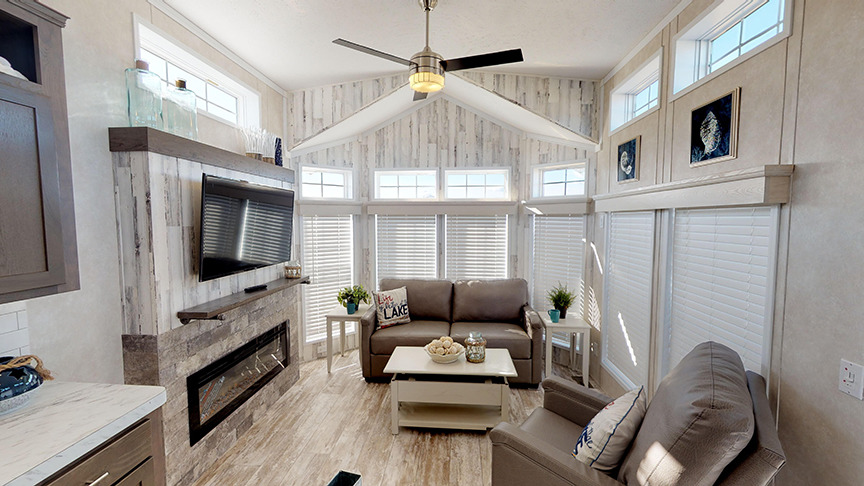 Electric fire place, mantle and built-in flat screen mount for TV in Fairmont's Park Model 148038.