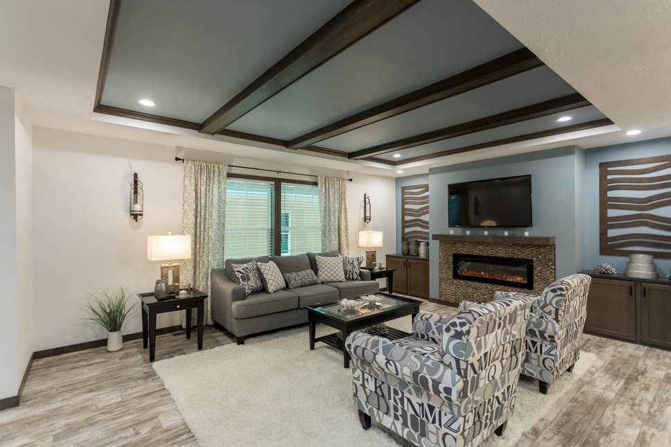 Gorgeous fireplace in the living room of the The Harbor Town by Fairmont Homes Model #92610KS.