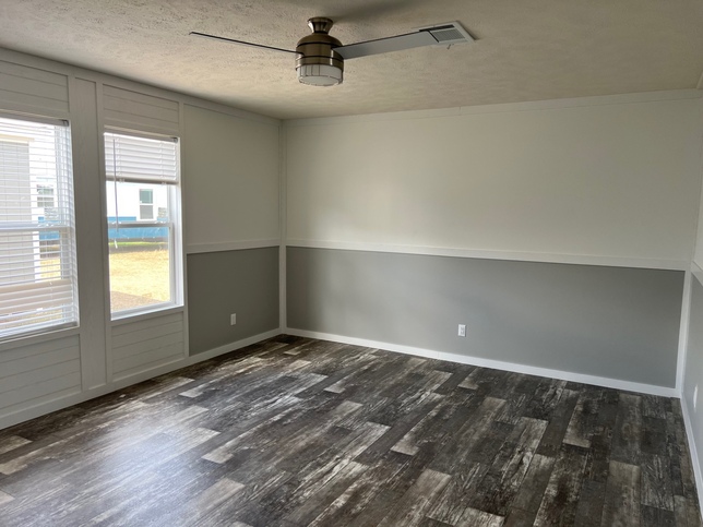 Large Master Bedroom has Wonderful Natural Lighting and Ceiling Fan 