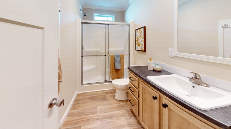 Black line drawing for The Cumberland - First HUD Approved Nationally Available Duplex | Side A: 2 bedroom, 1 bathroom, 1050 sqft | Side B: 2 bedroom, 1 bathroom, 1050 sqft. Double porch