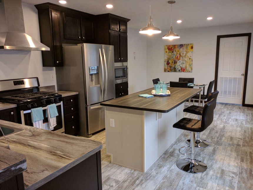 Gorgeous Kitchen with Island and Bar Area in this Beautiful 186035 Fulton Manufactured Home by Fairmont Homes