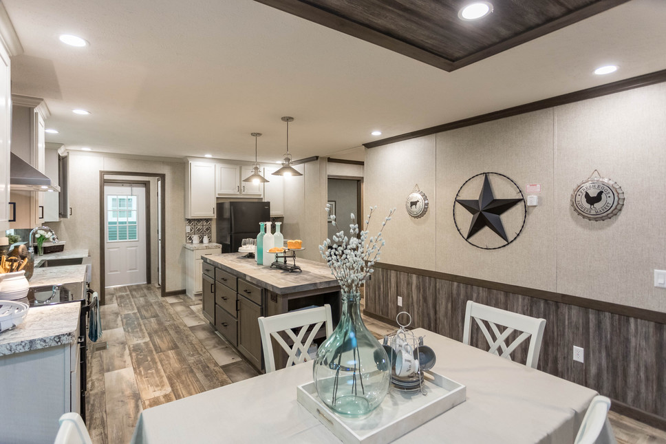Kitchen and Dining Area with Modern Decor in this 186046 Hyatt Beautiful Manufactured Home by Fairmont Homes