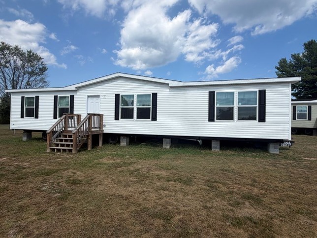 Aspen white siding with black shutters
