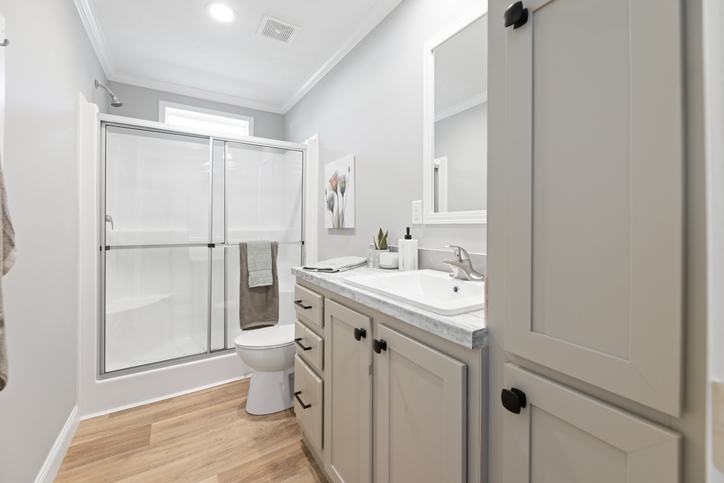 Black line drawing for The Cumberland - First HUD Approved Nationally Available Duplex | Side A: 2 bedroom, 1 bathroom, 1050 sqft | Side B: 2 bedroom, 1 bathroom, 1050 sqft. Double porch