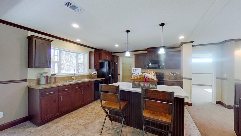Piper 28644A | 4 bedroom, 2 bathroom, 1707 sqft home | Built by Cavco - Moultrie in Moultrie, GA.