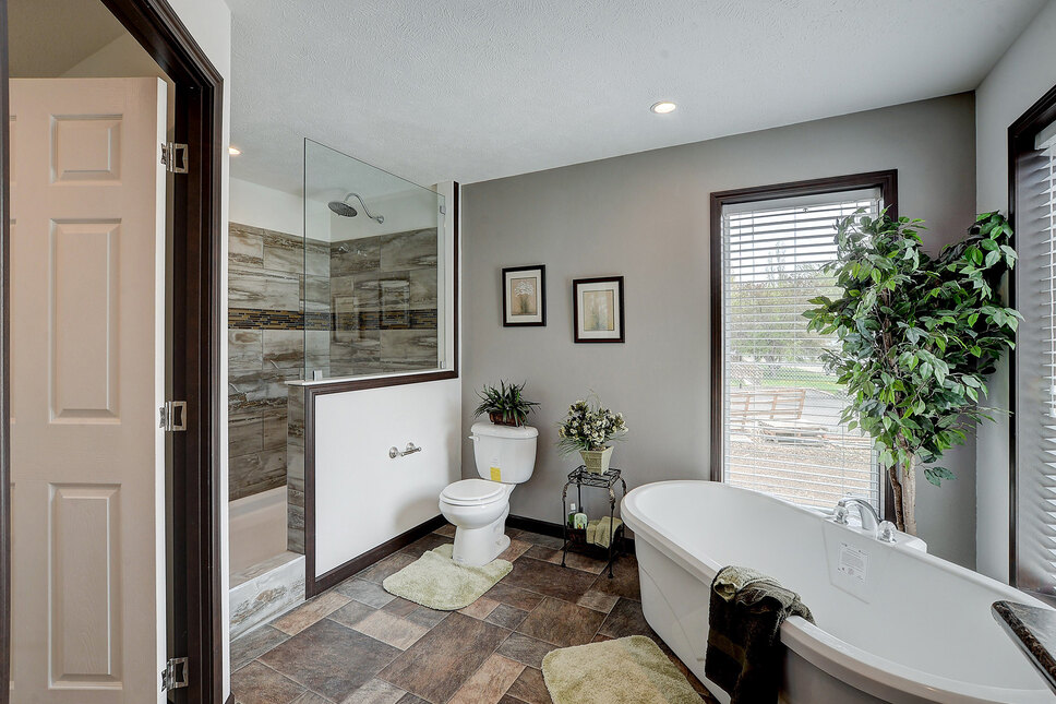 Stand-alone tub and spa shower in the Millennium Park 185004 by Friendship Homes