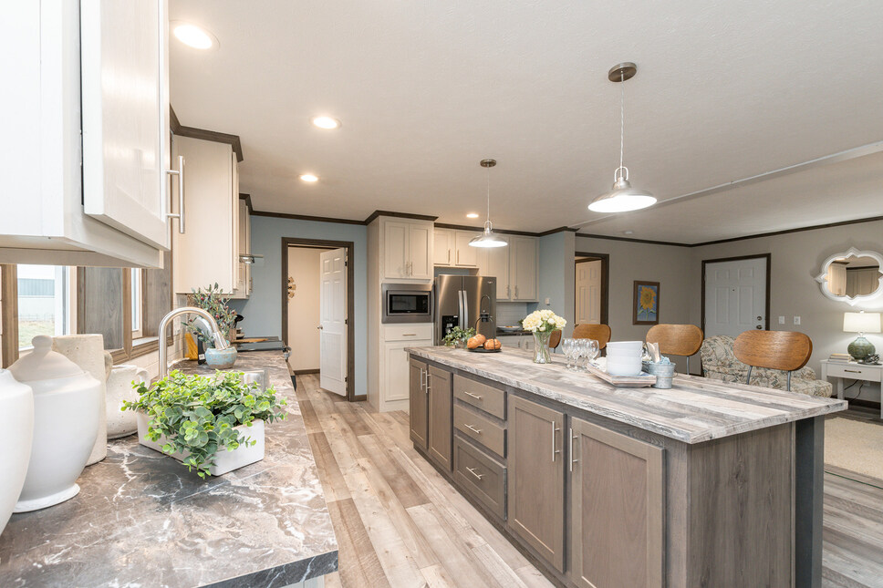 Fabulous island kitchen with acres of storage in the Shoreview model by Friendship Homes