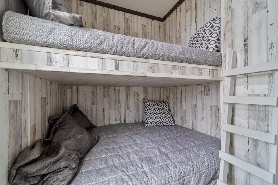 Second bedroom with bunk beds in the 190002 Cavco 150 from Fairmont Homes.