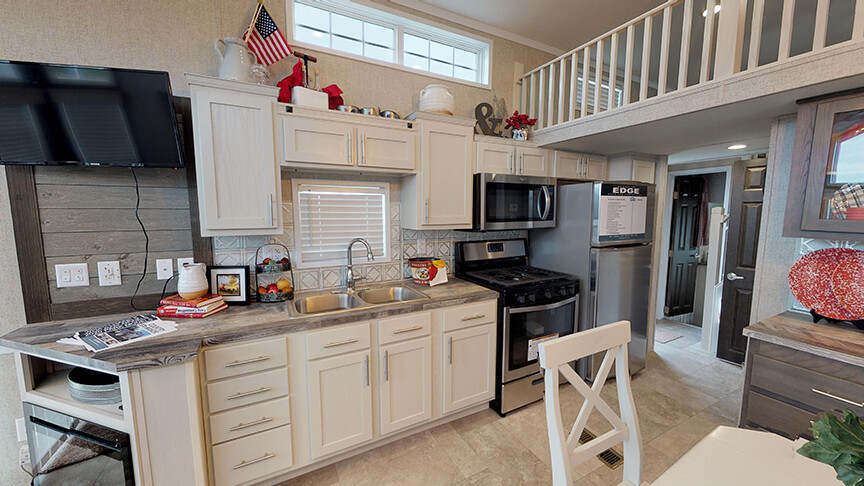 Functionally efficient kitchen area in the 100169 Country Manor from Fairmont Homes.