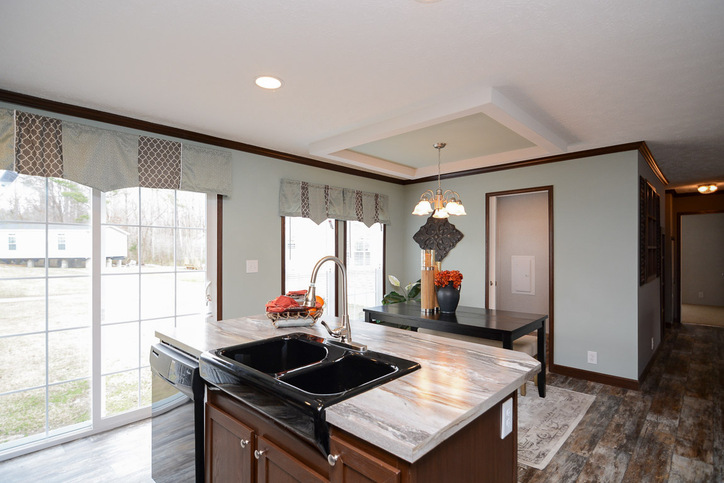 Velocity 28563K | 3 bedroom, 2 bathroom, 1484 sqft home | Built by Cavco - Rocky Mount in Rocky Mount, VA. - Kitchen toward Dining Area