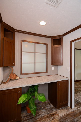 Velocity 28563K | 3 bedroom, 2 bathroom, 1484 sqft home | Built by Cavco - Rocky Mount in Rocky Mount, VA. - Utility Room Craft Table