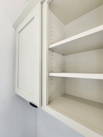 Even the utility room reflects thoughtful design, with a painted solid wood cabinet and matte black finger pulls that echo the finishes found throughout the home.

#ABetterWayToBuild