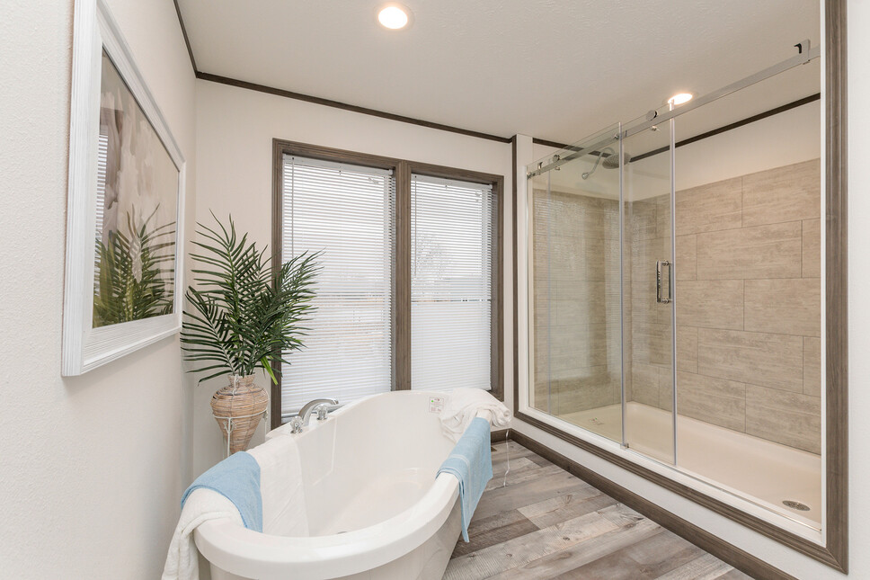 Light, airy and bright + HUGE shower in the Shoreview model by Friendship Homes